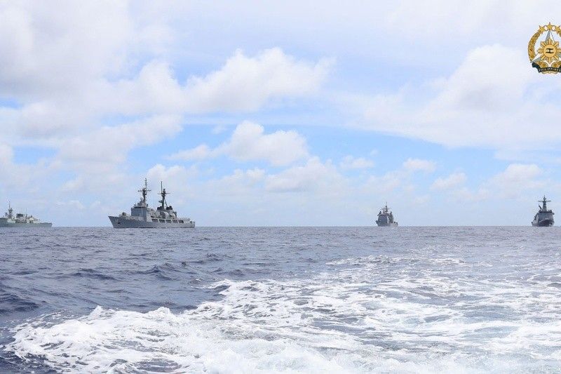 China launches air, sea patrols near flashpoint reef as US holds joint drills