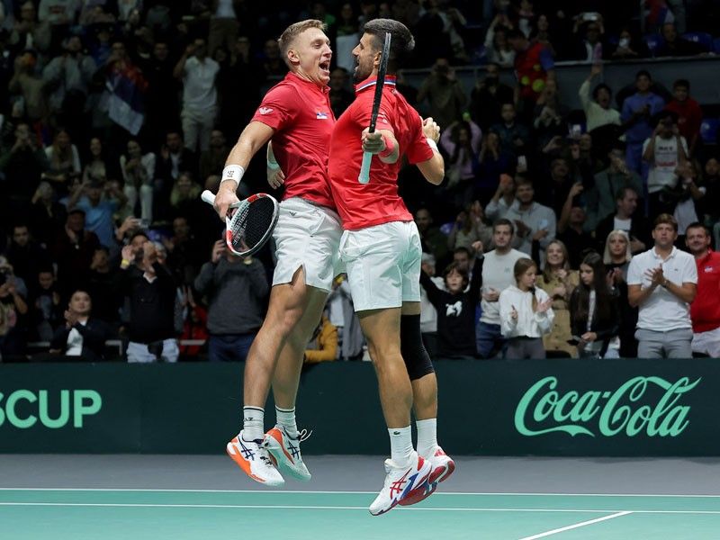 Doubles win for Djokovic secures Serbia's Davis Cup status