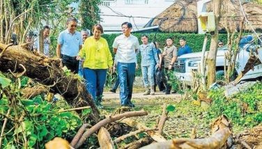 President Marcos inspects the aftermath of Typhoon Julian in Batanes yesterday.