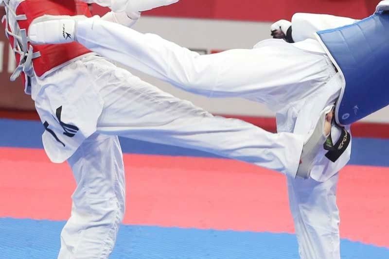 Mangin wins gold in world Jr. taekwondo