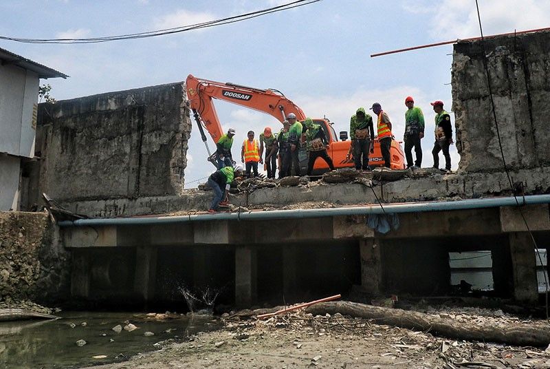 Pier 2 wall demolished to ease flooding woes