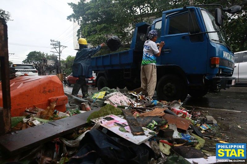 87 trucks of garbage hauled in Manila after storm