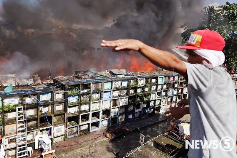 Fire razes houses inside Quezon City cemetery