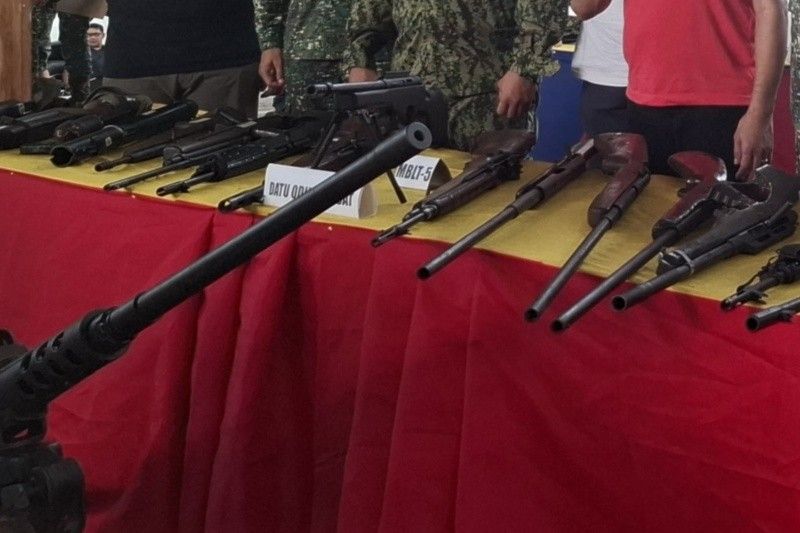 Moro, ethnic Teduray villagers surrender firearms to Marines