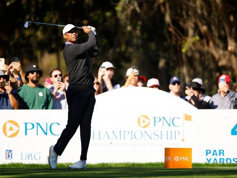 Tiger in family golf event but has 'long way' before PGA return