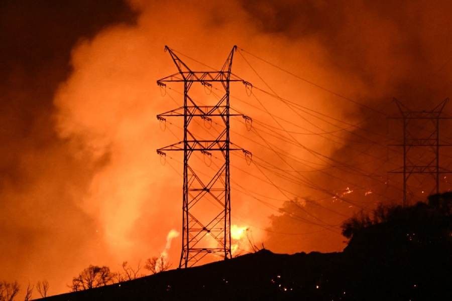 Firefighters race to beat LA blazes as winds grow and death toll hits 16