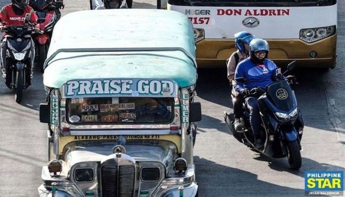 Motorcycle taxis ferrying passengers traverse EDSA in Pasay during rush hour on January 20, 2025.