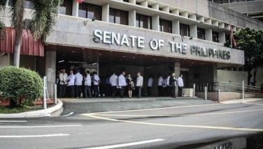 Employees enter the Senate of the Philippines as seen in this photo release on August 5, 2024. 
