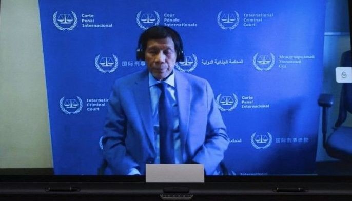 Former Philippine President Rodrigo Duterte is seen on a screen in the courtroom during his first appearance before the International Criminal Court (ICC) on charge of crimes against humanity over his deadly crackdown on narcotics, in The Hague on March 14, 2025. 