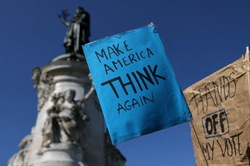 Tens of thousands march in US against Trump 'devastation'