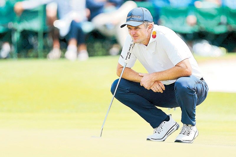 Justin hangs on, Rory catches up