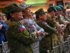 Troops from the Philippines and the United States stand beside each other at the opening ceremony of the Balikatan exercises, Camp Aguinaldo, Quezon City, April 21, 2025.