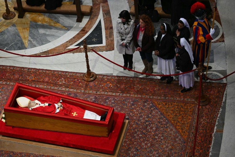 Thousands gather for second day to view Pope Francis