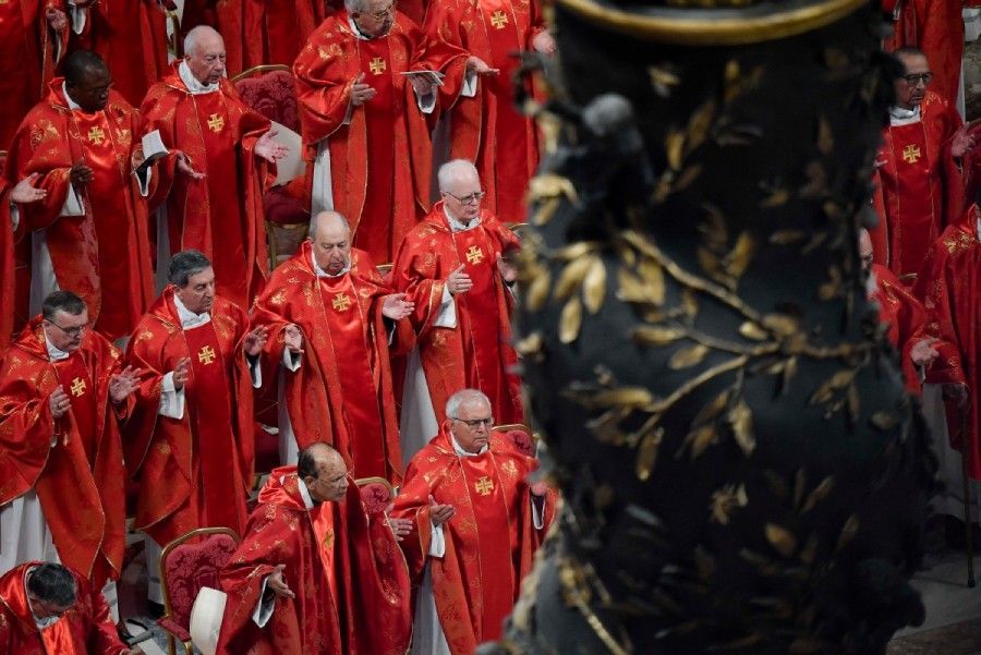 Cardinals pray as conclave rituals begin
