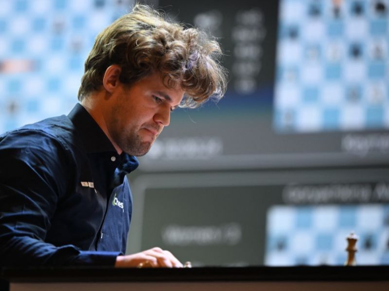 Chess great Carlsen held to draw by 143,000 players