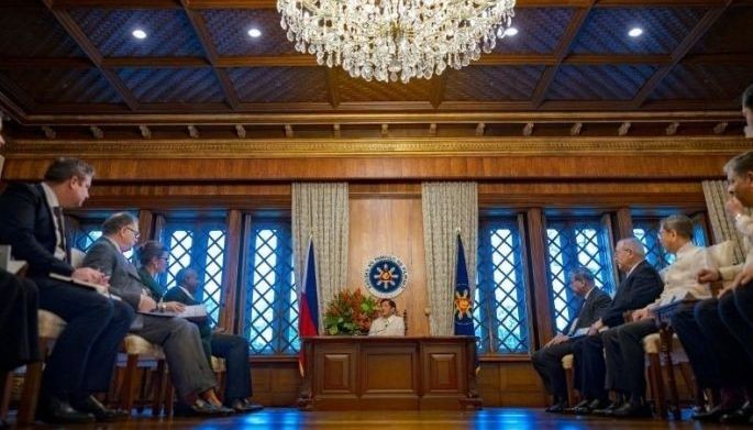 Philippine President Ferdinand Marcos (C) speaks as he meets with British Foreign Minister David Lammy (4th L) at the Malacanang Palace in Manila on March 8, 2025.