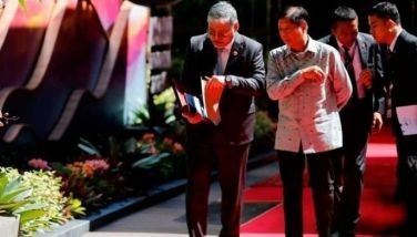 President Ferdinand Marcos (2nd L) and Secretary of Foreign Affairs Enrique Manalo (L) attend the Association of Southeast Asian Nations (ASEAN) Summit in Labuan Bajo on May 11, 2023. 