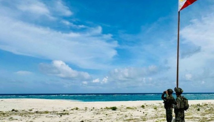A Philippine Marine inspects coastal defenses on Likas detachment during a maritime security patrol in the West Philippine Sea on Thursday, June 5, 2025.