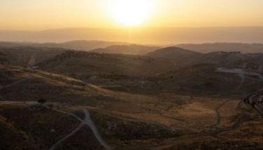 A general view from Jerusalem over the Jordan valley is pictured at sunrise on June 13, 2025.