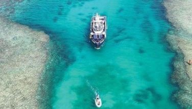 This handout photo taken on March 23, 2024 and released by the Philippine Bureau of Fisheries and Aquatic Resources (PCG/BFAR) on March 25, 2024 shows an aerial view of BRP Datu Pagbuaya as it sails from the Philippine-held Thitu Island sheltered port, in the Spratly Islands, in the disputed South China Sea. 