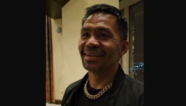 Manny Pacquiao smiles while talking to reporters inside his suite at the MGM Grand in Las Vegas on Monday, July 14 (Tuesday July 15 Manila time).