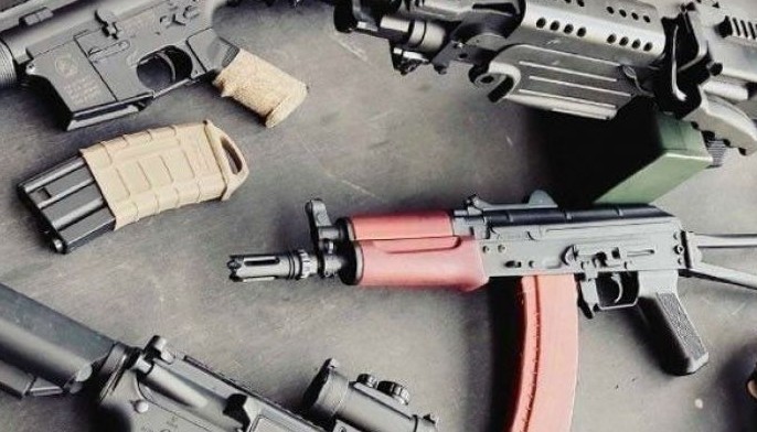 Town exec held for illegal guns