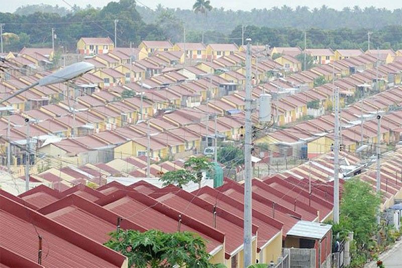 Marcos turns over 1,099 houses in Laguna