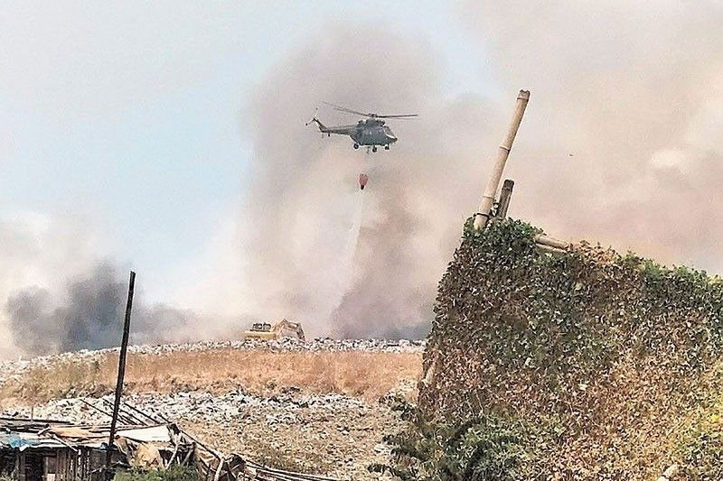 Navotas builds road to burning landfill site