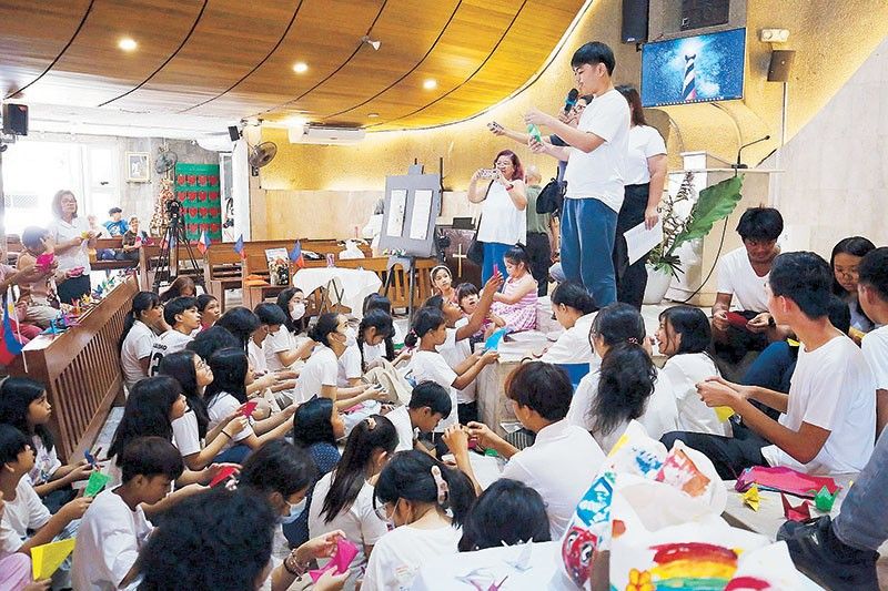 Quezon City kids fold paper cranes for peace