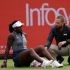 Canada's Victoria Mboko reacts after slipping on the grass attempting to play a return shot against Czech Republic's Karolina Pliskova during their round of 16 women's singles match at the HSBC WTA tennis Championships at Queen's Club in west London on June 10, 2026. Pliskova won the match 6-2, 3-4 after Mboko retired in the second set.