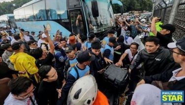 Police push back members of the Iglesia ni Cristo (INC), while several protesters are handcuffed, after thousands of church members staged an unannounced rally in support of Senator Rodante Marcoleta and occupied the northbound lanes of EDSA on June 30, 2026 triggering heavy traffic across major roads in Metro Manila during the morning rush hour.