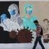 A man walks past a COVID-19-themed mural in Barangay Bagong Ilog, Pasig City on April 18, 2023. 