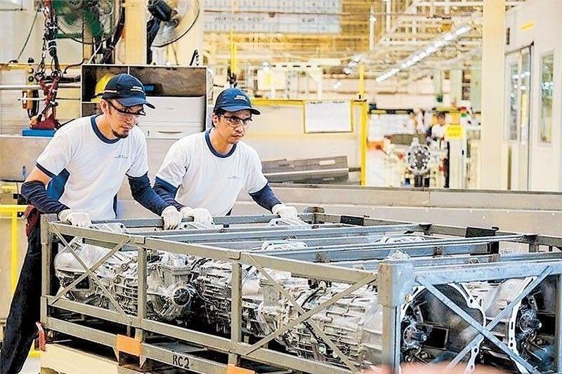 Factory output growth eases in May
