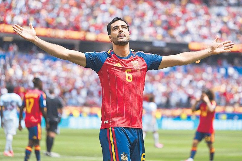 Super sub Merino saves Spain