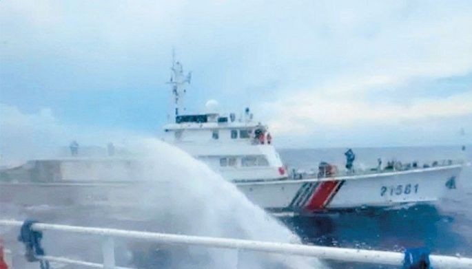 China blasts Philippines vessels with water cannons anew