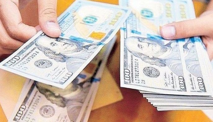 Dollar reserves slip to 18-month low