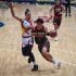 San Miguel's Marcio Lassiter (13) defends Titan Ultra's Bryan Sajonia