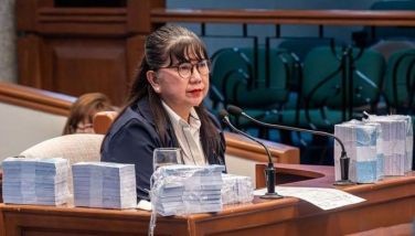 Former Office of the Vice President special disbursing officer Gina Acosta answers questions from prosecution lawyer Atty. Amando Ligutan as the prosecution presents an AI-generated sample image depicting P125 million in cash inside bags, along with prop money representing the amount, during the 16th day of the impeachment trial of Vice President Sara Duterte at the Senate in Pasay City on August 17, 2026.
