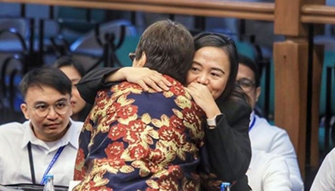 &lsquo;Generational divide&rsquo; lawyers share a hug