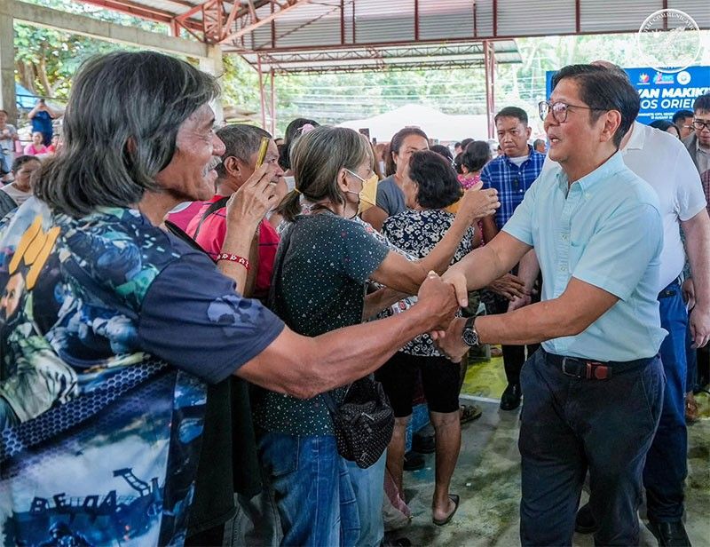 Marcos Distributes Scholarships and Rice Aid in Negros Oriental