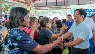 Marcos distributes scholarships, rice aid in Negros