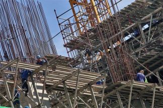 In this February 7, 2024 file photo, Workers are seen performing their duties at a construction site in Taguig.