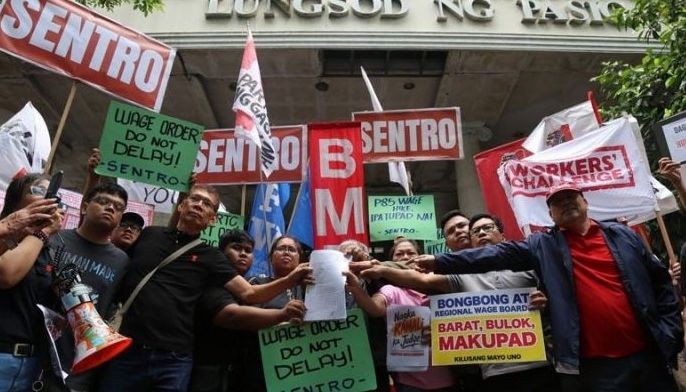 Labor groups: Lift wage hike injunction