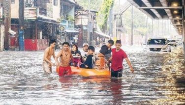 Heavy monsoon rains flood Metro Manila roads anew
