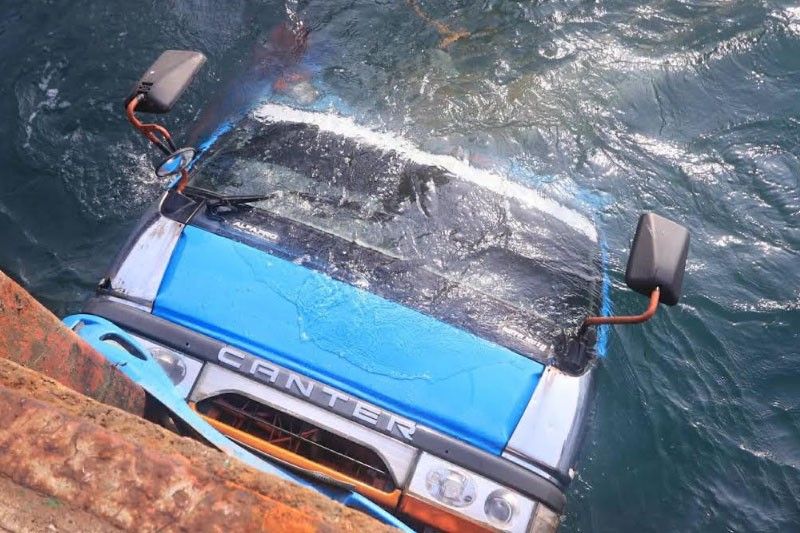 Truck goes overboard while being loaded onto vessel