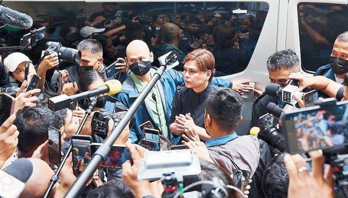 Vice President Sara Duterte talks to members of the media, asking them to accompany her to the 5th floor of the QC Hall of Justice where she was to post bail yesterday for her grave threats case.