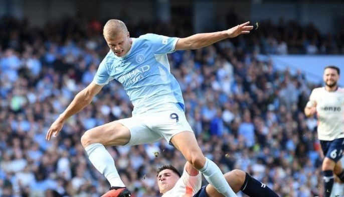 Haaland heads unconvincing Man City top of Premier League