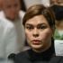 Philippine Vice President Sara Duterte shows a document after posting bail at a court building in Quezon City suburban Manila on September 5, 2026.