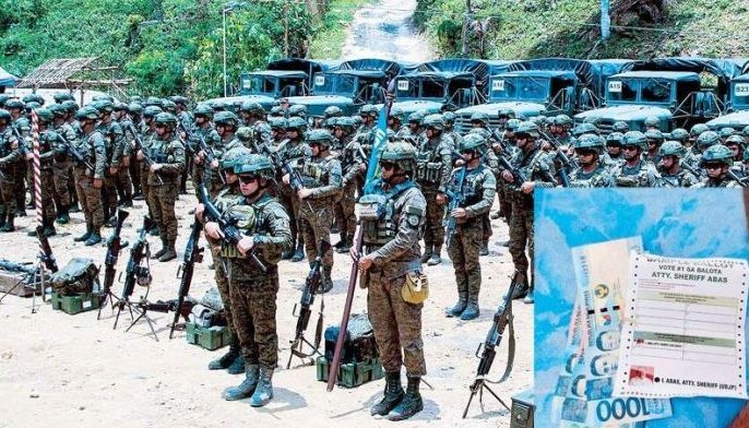 Army soldiers prepare for deployment to secure the first Bangsamoro Autonomous Region in Muslim Mindanao parliamentary election today. Inset shows a sample ballot of Sheriff Abas with three P1,000 bills posted on Facebook ahead of the BARMM polls.