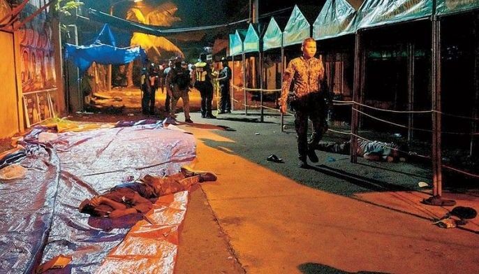 Photo shows a victim at the scene of a shooting incident outside a polling station in Cotabato City hours before opening